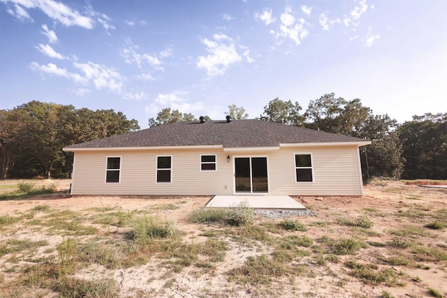 rear view of property featuring a patio area