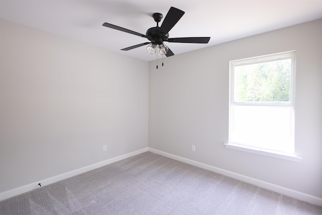 spare room featuring ceiling fan and carpet flooring