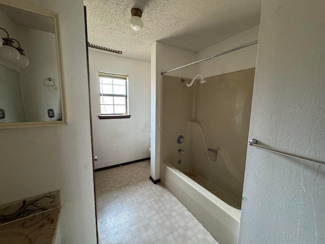 bathroom featuring shower / washtub combination and a textured ceiling