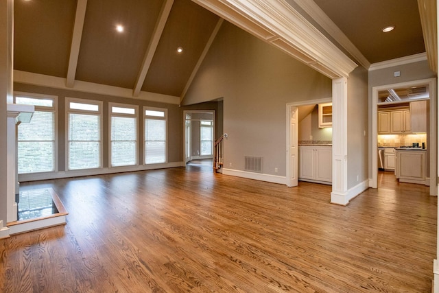 unfurnished living room with beamed ceiling, ornamental molding, high vaulted ceiling, and light hardwood / wood-style floors