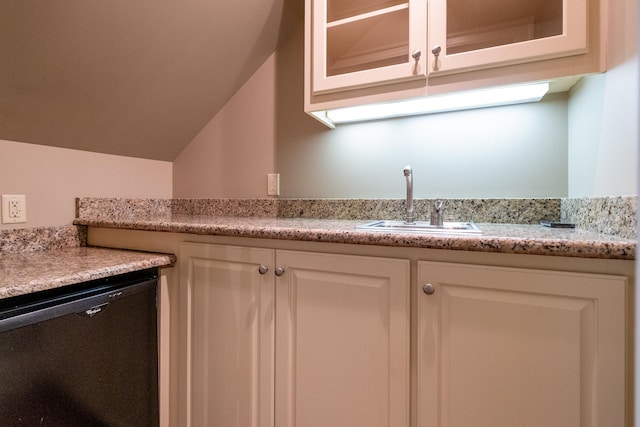 interior space with white cabinetry, dishwasher, vaulted ceiling, and sink