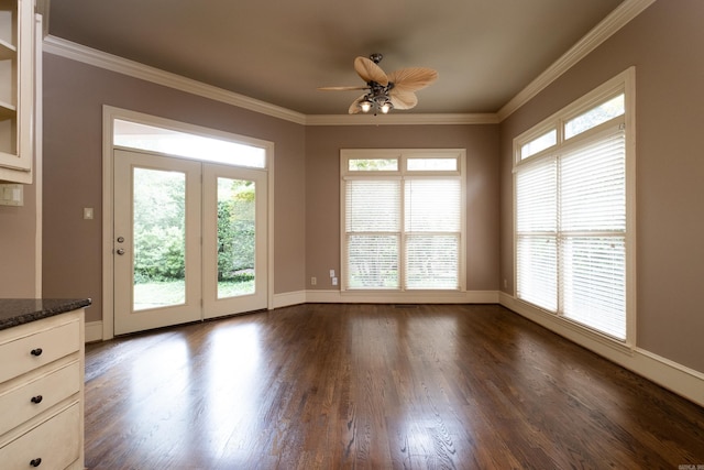 interior space with ceiling fan, ornamental molding, and dark hardwood / wood-style floors