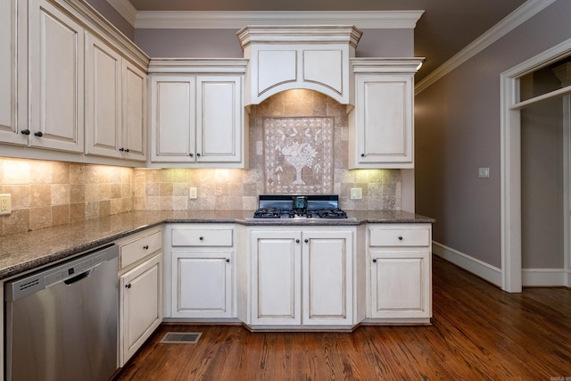 kitchen featuring ornamental molding, appliances with stainless steel finishes, backsplash, and dark hardwood / wood-style flooring