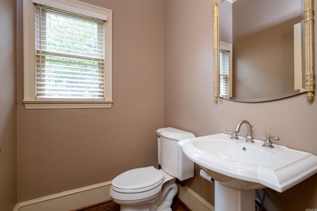 bathroom featuring toilet and sink