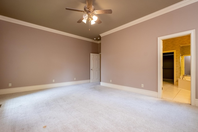 carpeted spare room featuring ornamental molding and ceiling fan