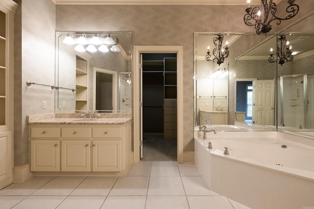 bathroom featuring an inviting chandelier, tile patterned floors, separate shower and tub, and vanity