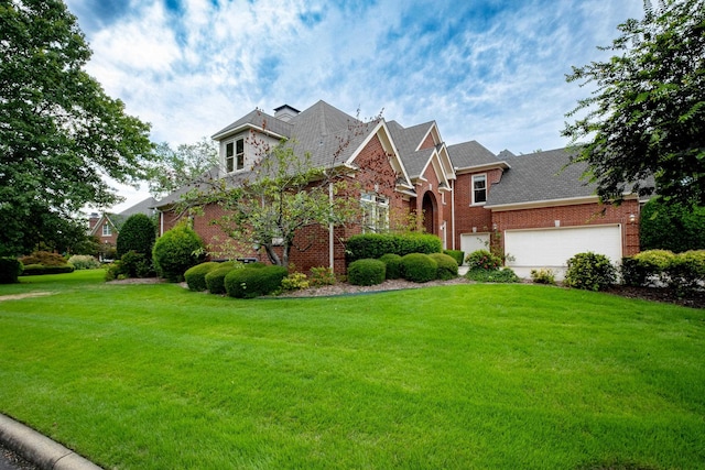 front facade with a garage and a front lawn