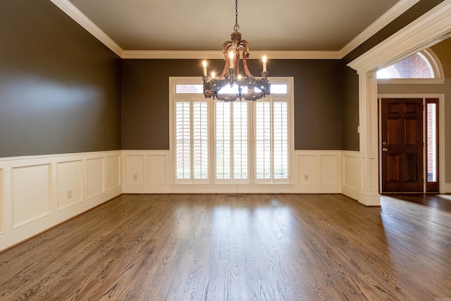 interior space with crown molding, dark hardwood / wood-style floors, and a chandelier