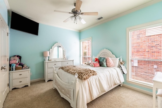 bedroom featuring crown molding, light carpet, and ceiling fan