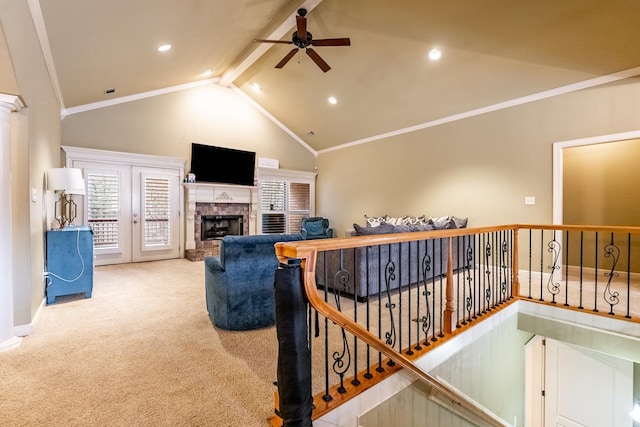 living room featuring vaulted ceiling with beams, crown molding, ceiling fan, and carpet flooring