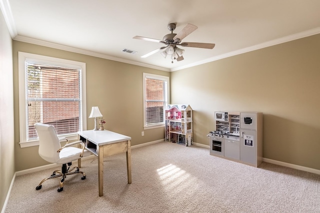 home office featuring crown molding, light colored carpet, and ceiling fan