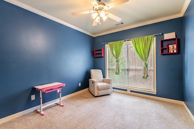 living area featuring crown molding, carpet, and ceiling fan