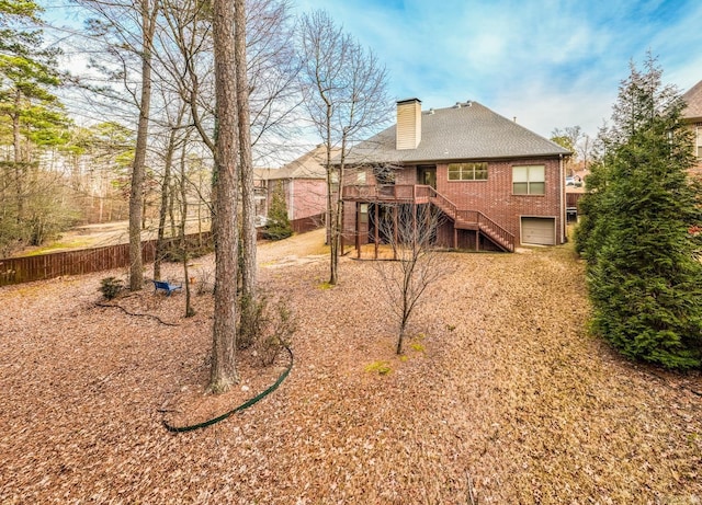 exterior space with a garage and a deck