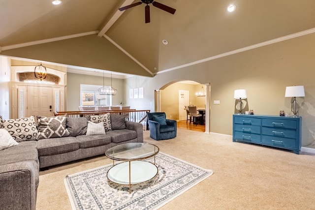 carpeted living room featuring crown molding, high vaulted ceiling, ceiling fan, and beam ceiling