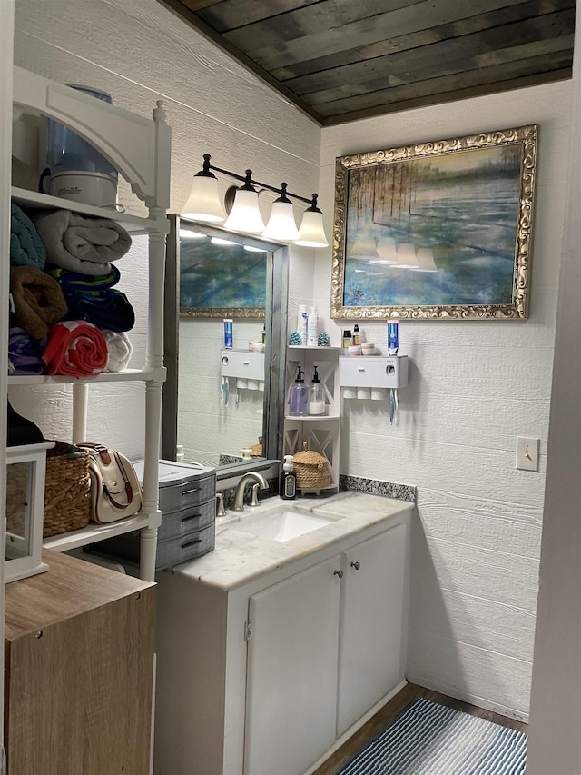 bathroom featuring vanity and wood ceiling