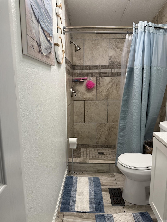 bathroom featuring vanity, toilet, and walk in shower