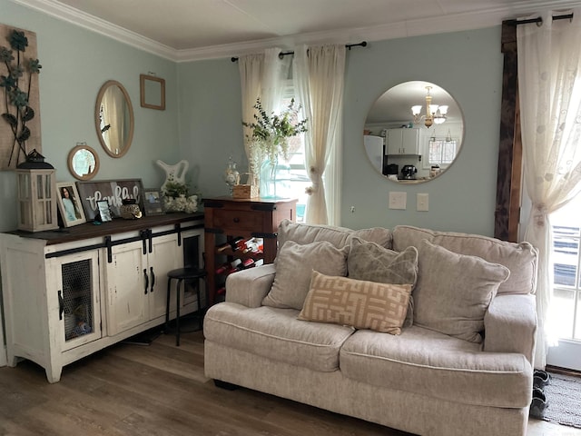 living room with ornamental molding, a wealth of natural light, and hardwood / wood-style floors