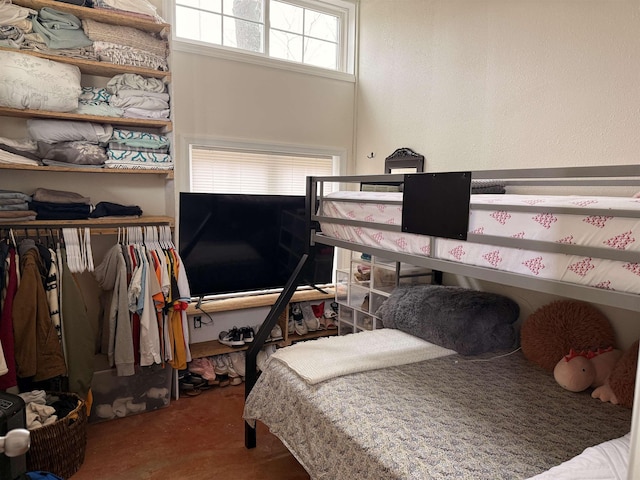 bedroom featuring a closet and a high ceiling