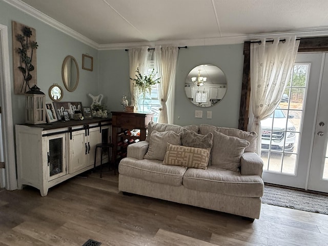 living room with ornamental molding and hardwood / wood-style floors