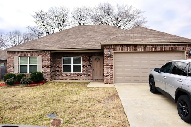 ranch-style house with a garage and a front lawn