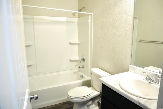 full bathroom with vanity, wood-type flooring, tub / shower combination, and toilet