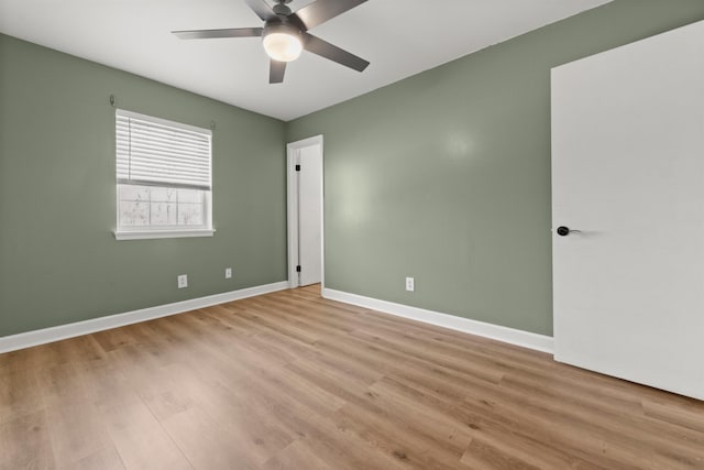 spare room with ceiling fan and light hardwood / wood-style floors