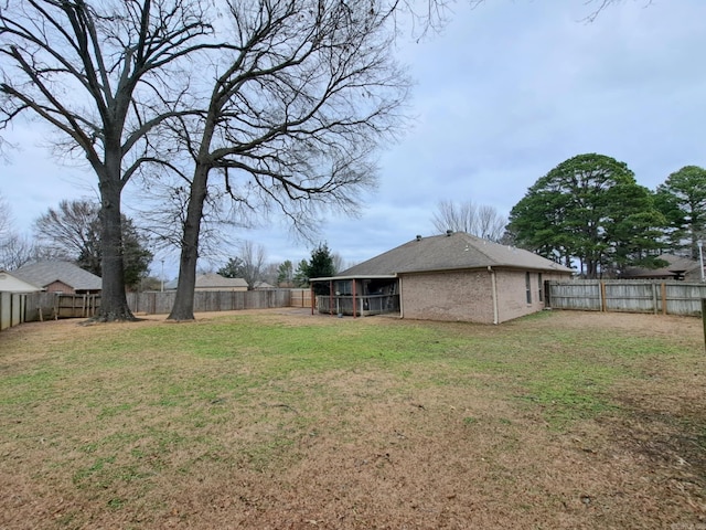 view of yard with a sunroom