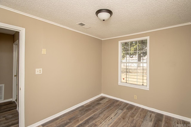 empty room featuring crown molding, dark wood-type flooring, and a textured ceiling