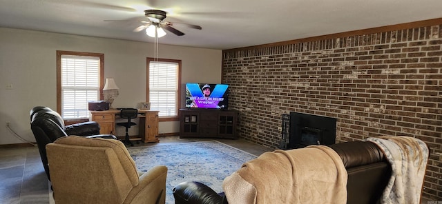 living room with ceiling fan and brick wall