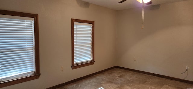 spare room featuring ceiling fan