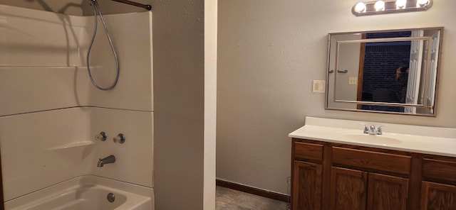 bathroom with vanity and  shower combination