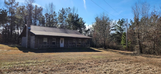 view of front of home with a porch and a front lawn