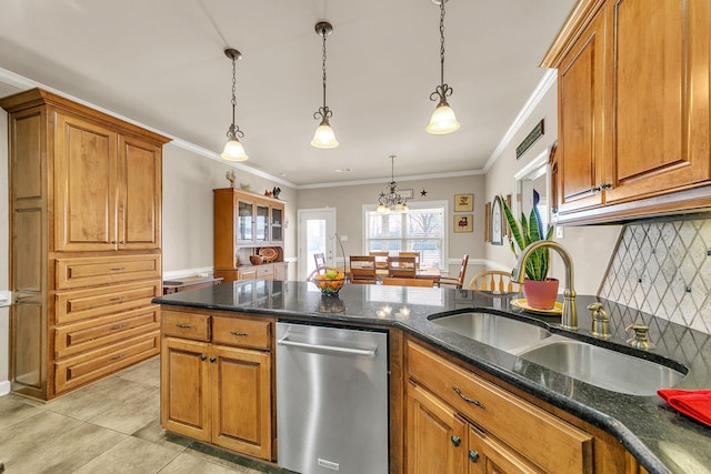 kitchen with decorative backsplash, brown cabinetry, decorative light fixtures, stainless steel dishwasher, and a sink