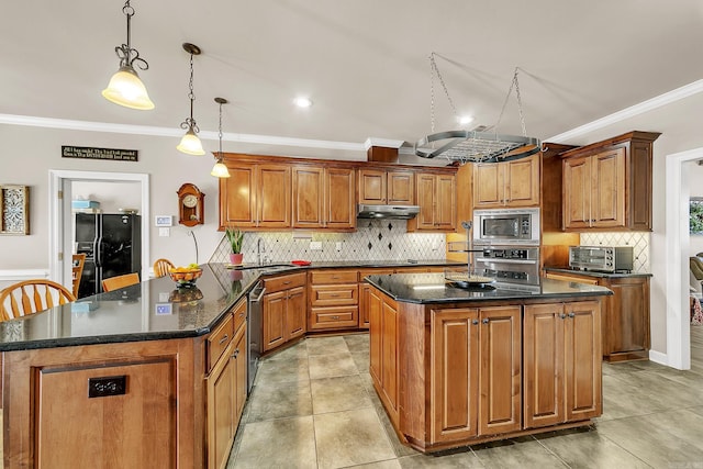 kitchen featuring a sink, black appliances, brown cabinets, and a center island