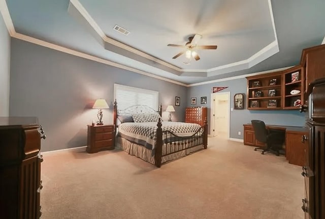 bedroom featuring a raised ceiling, light colored carpet, visible vents, ornamental molding, and baseboards