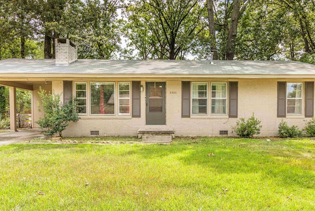 ranch-style home with a front lawn