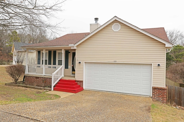 ranch-style home featuring a porch and a garage