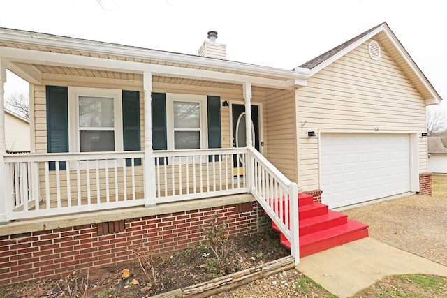 ranch-style house featuring a garage and a porch