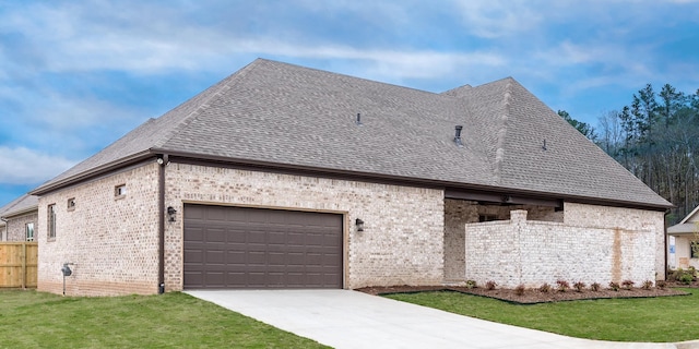 view of side of property with a yard