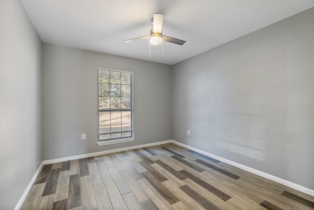 unfurnished room featuring hardwood / wood-style floors and ceiling fan