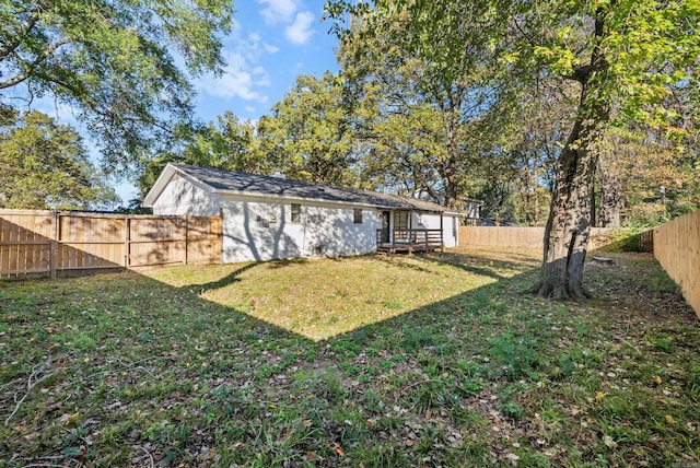 rear view of property with a yard