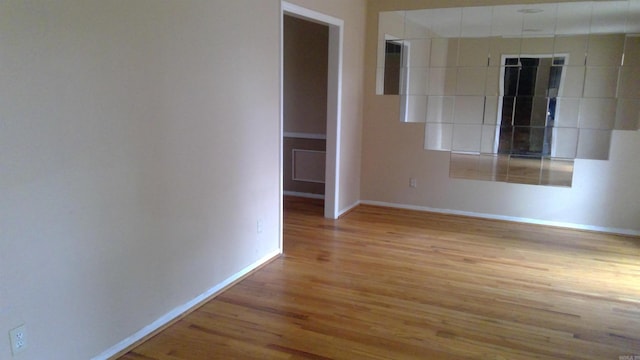 spare room with light hardwood / wood-style floors