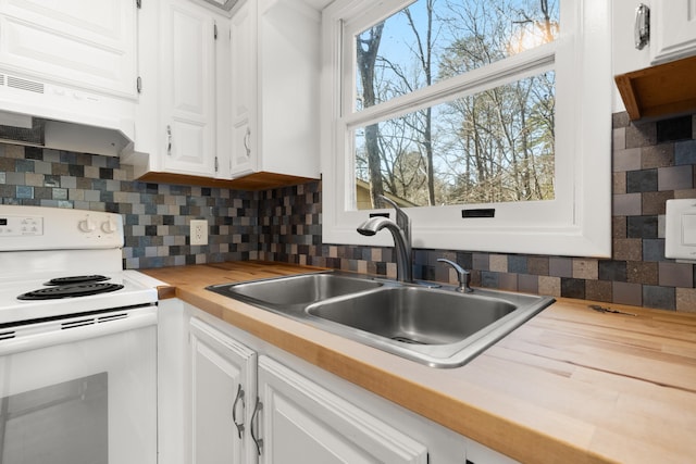 kitchen featuring white cabinets, sink, and white range with electric stovetop