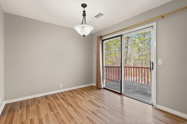 spare room featuring light wood-type flooring