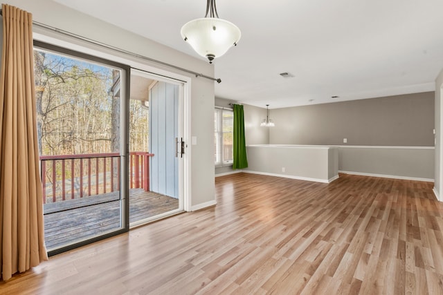 spare room with light hardwood / wood-style floors