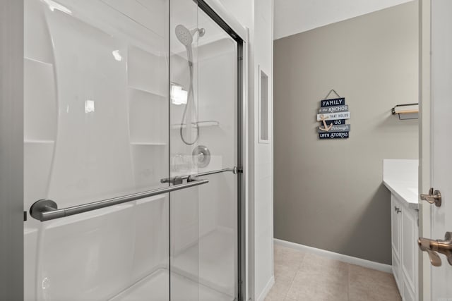 bathroom with vanity, tile patterned floors, and walk in shower