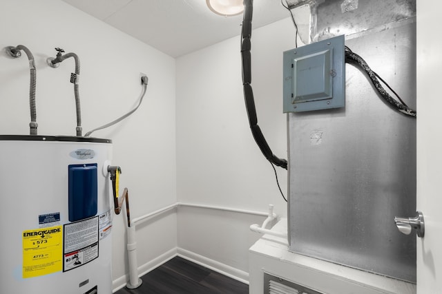 utility room featuring water heater and electric panel