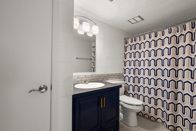 bathroom featuring tile patterned floors, toilet, a shower with curtain, tile walls, and vanity