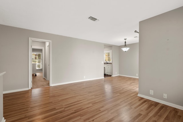 unfurnished living room featuring light wood-type flooring