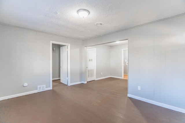 empty room with a textured ceiling